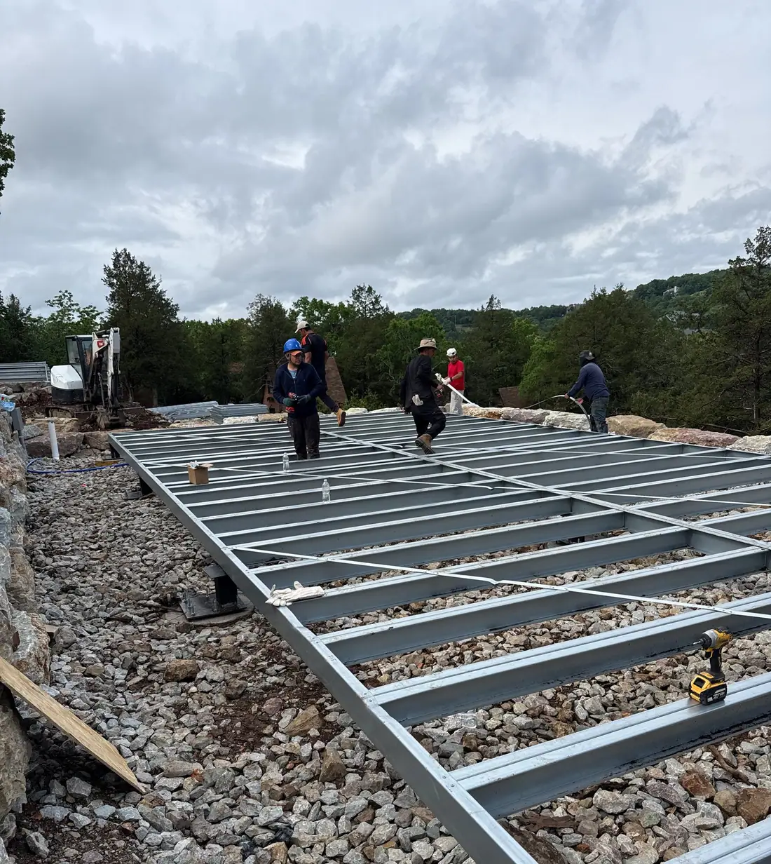 Field crew working on a metal frame, representing the KK Data Field Logger App Store launch update