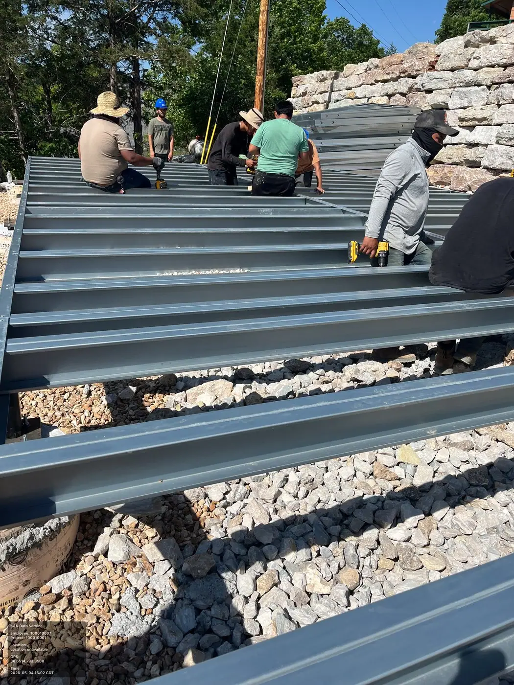 Steel beam work during prefab modular structure assembly at an active jobsite