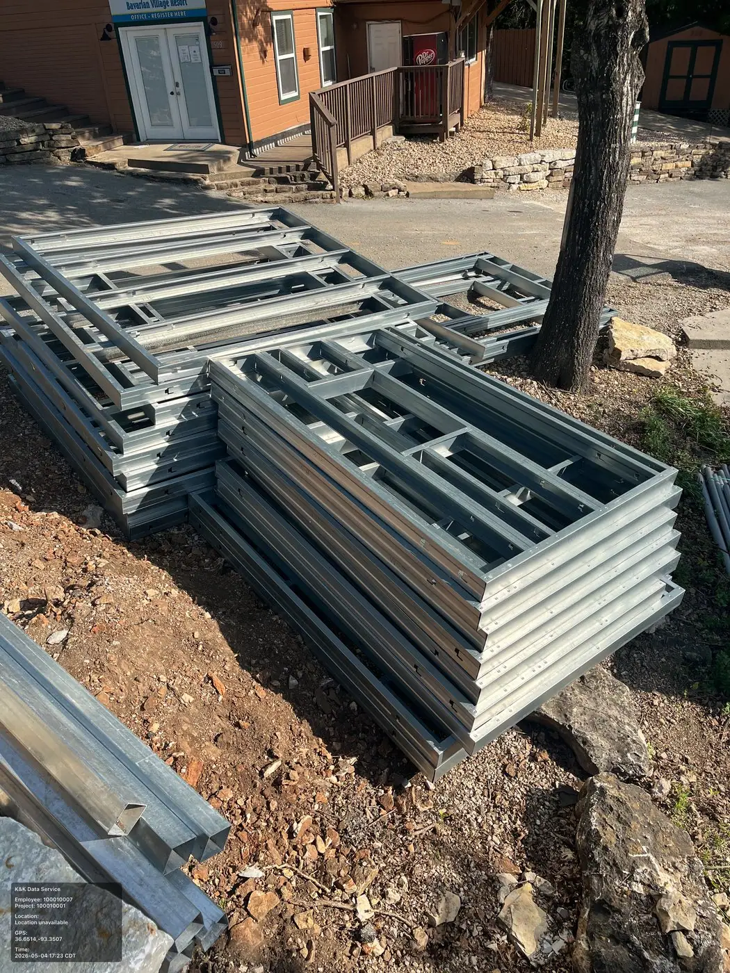 Prefab modular construction materials staged on a field site