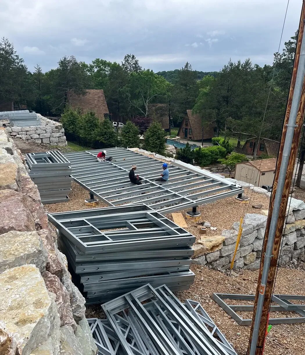 Prefab frame layout on a sloped site used to review access, foundation, and delivery facts