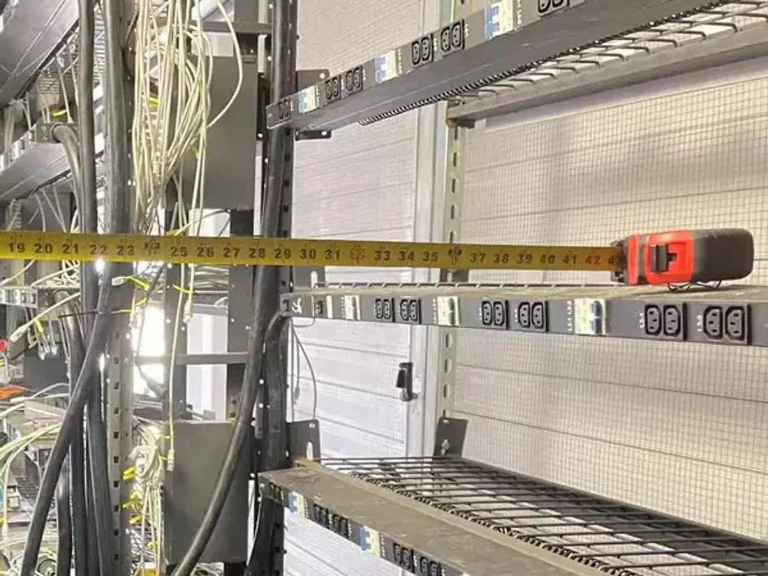 Rack measurement photo used to document field clearance and service conditions