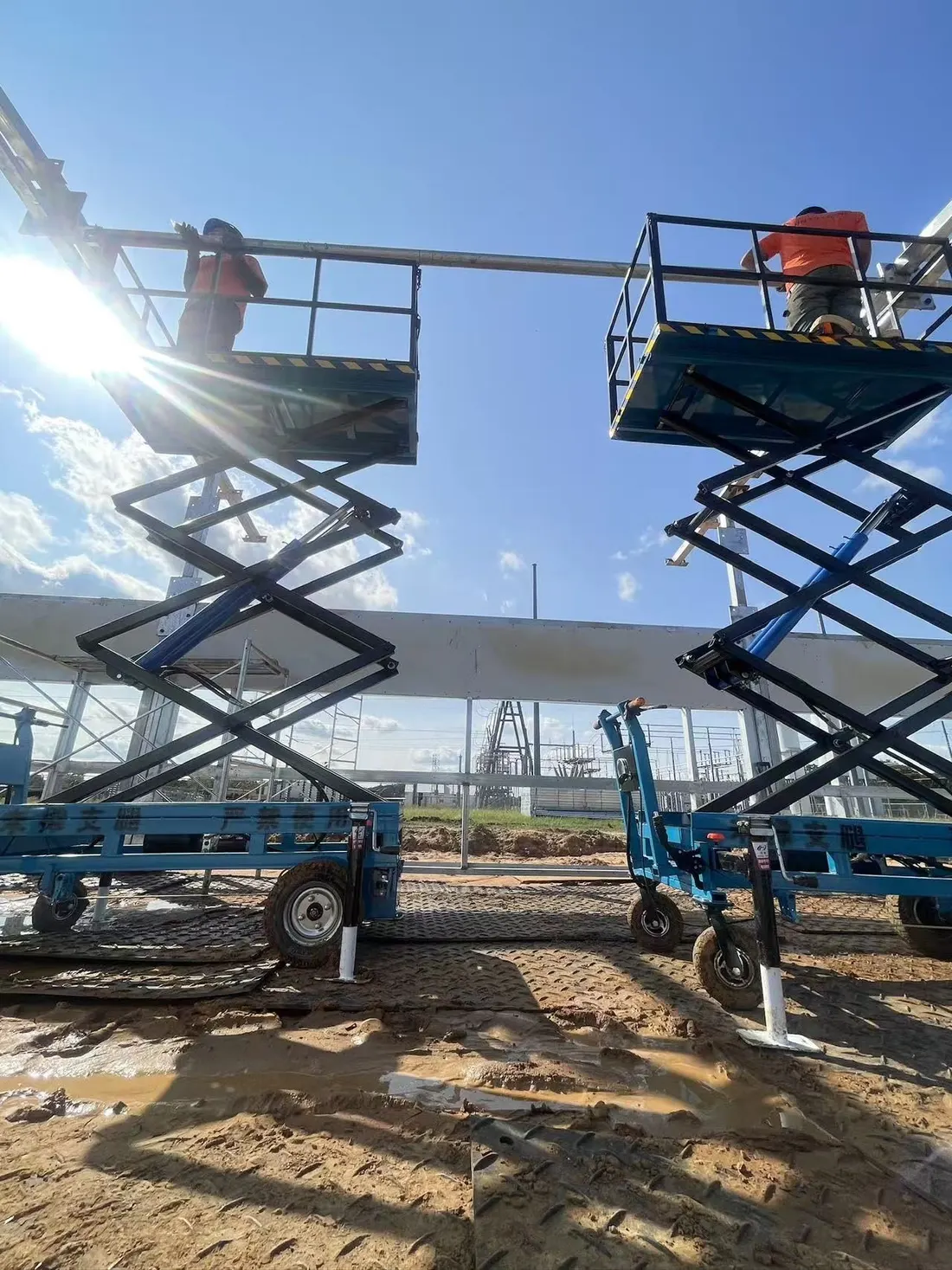 Field crew installing structural steel at an active construction site