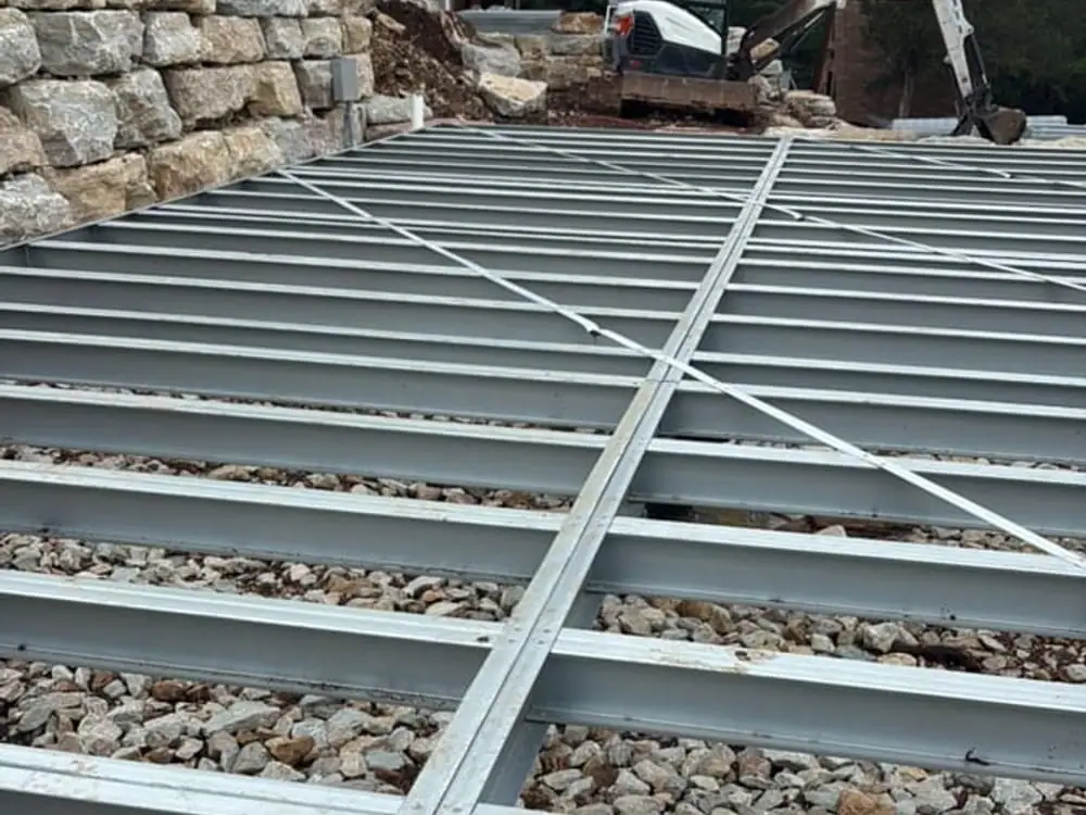 Privacy-safe field steel grid showing readable load paths and assembly spacing