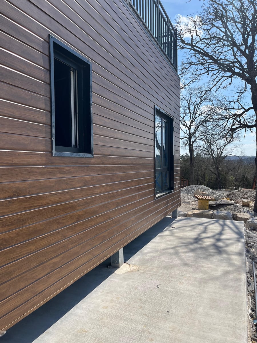 Installed cladding reference for exterior finish, trim, openings, and buyer review