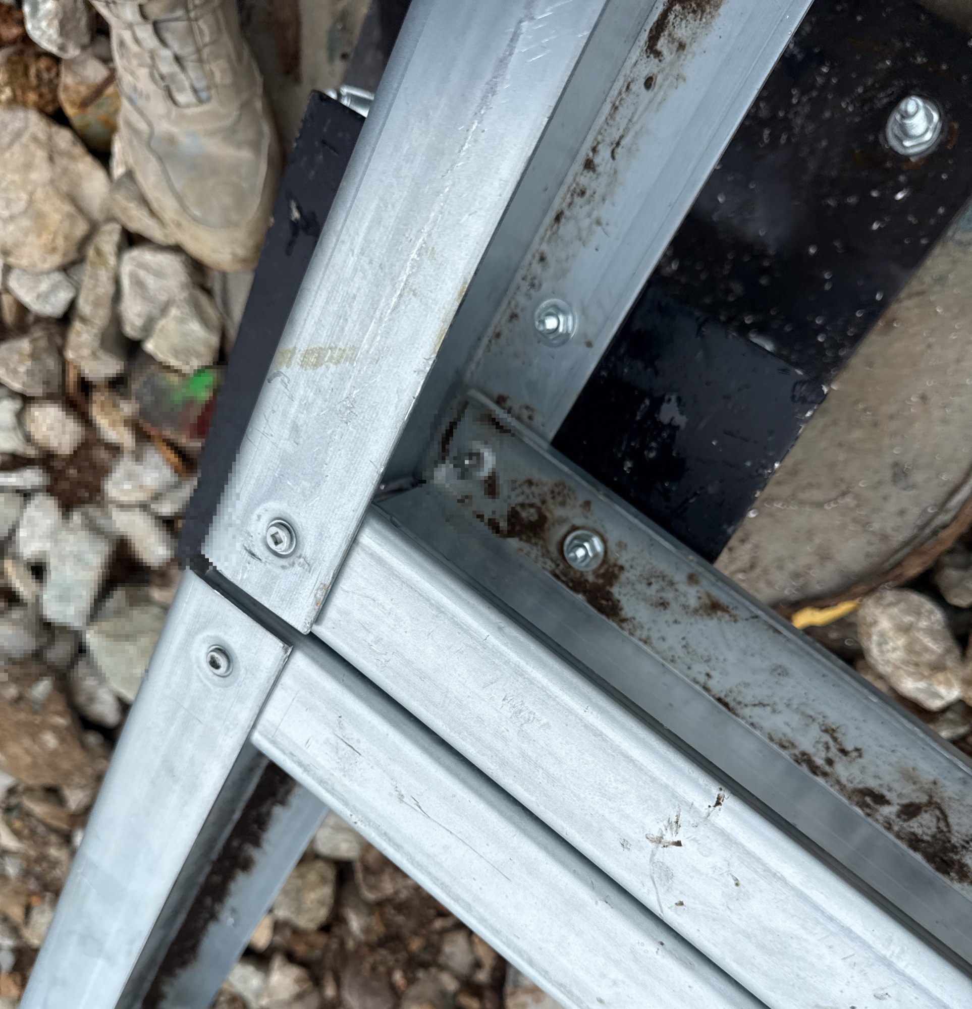 Bolted joint in the steel floor frame above the gravel bed, 5 May 2026