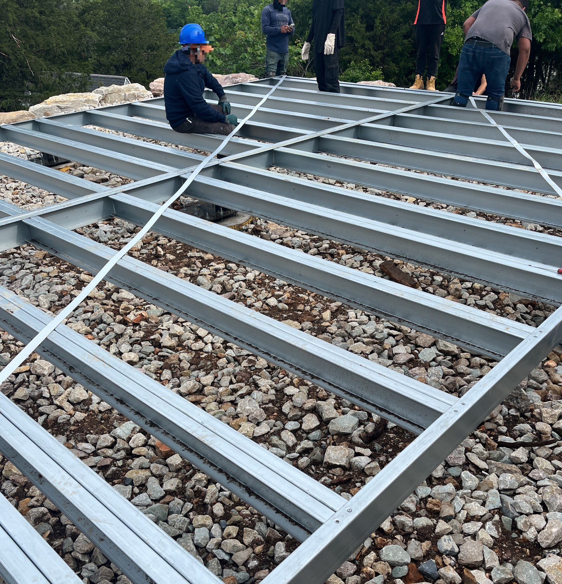 Completed steel floor frame with crew standing on it, 5 May 2026